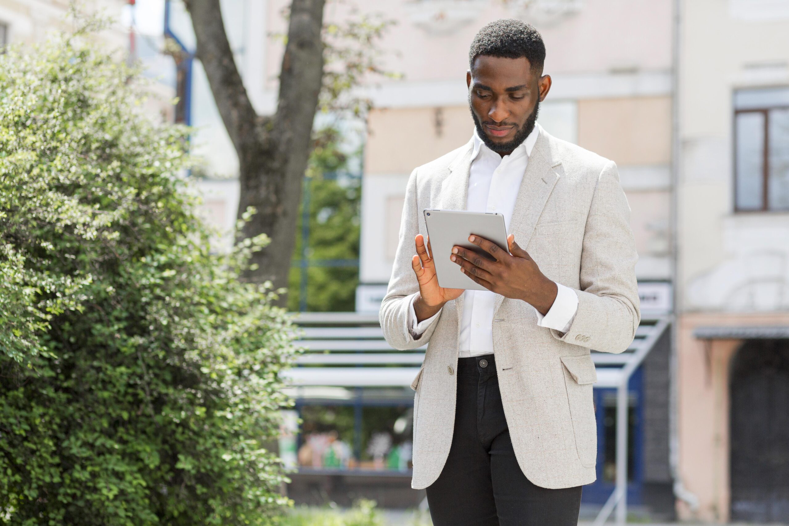 businessman-looking-tablet https://www.reson8.biz/wp-content/uploads/2025/07/businessman-looking-tablet-scaled.jpg